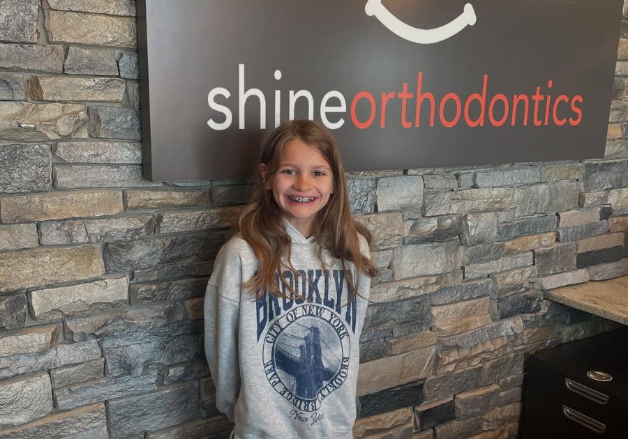 girl poses in the Shine building